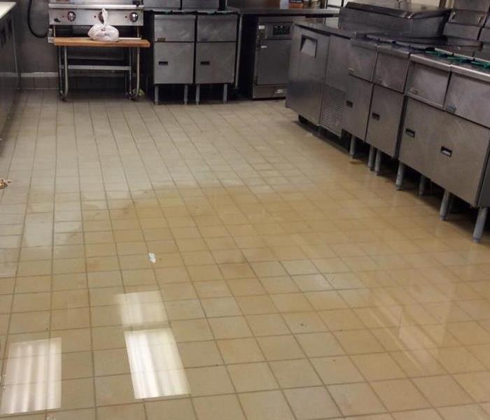 Dirty flood water on restaurant's kitchen floor
